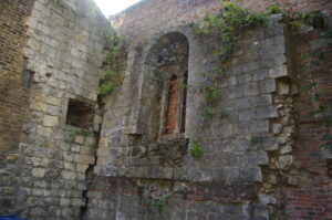 Ruined stone walls with an arched window.